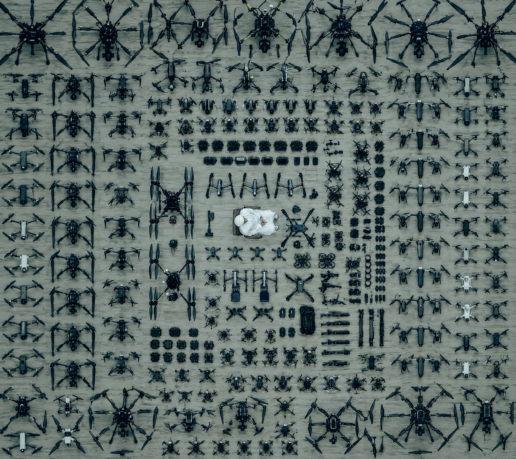 The SKY I drone fleet laid out around a seated pilot, seen from above